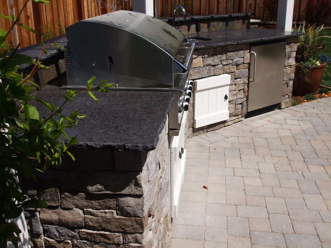 large stone veneer custom bbq with stone top