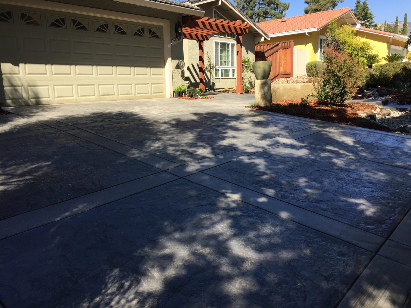 stamped concrete with broom finish border and inlay