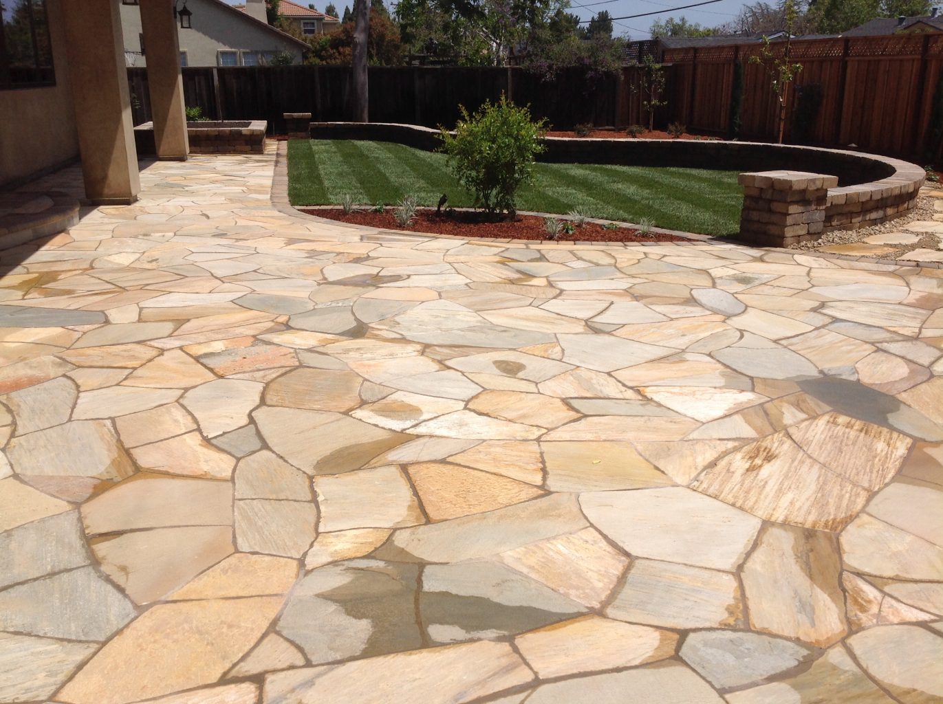 large flagstone patio and natural grass