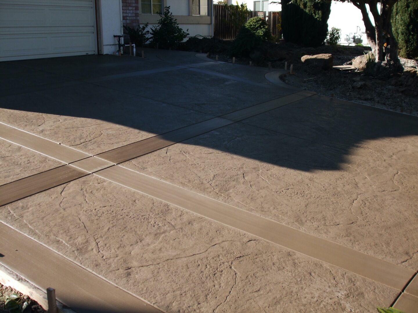 stamped concrete driveway with custom deep score control joints to add depth and definition.